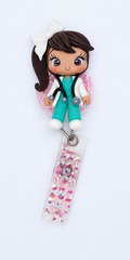 Character figurine with a stethoscope and colorful badge reel on a white background
